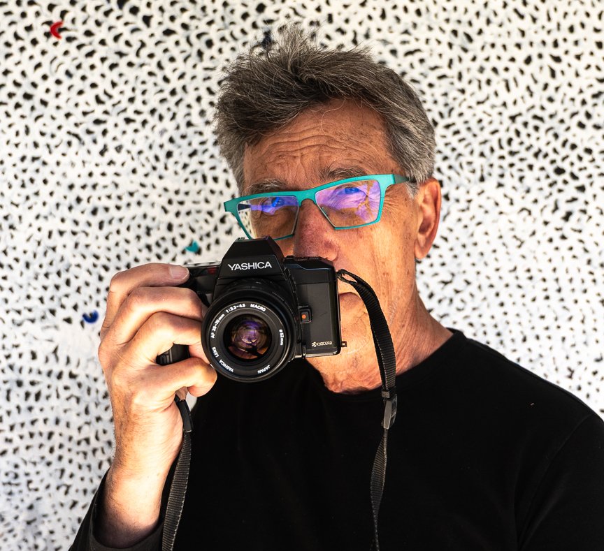 Michael Babiak holding a Yashica film camera